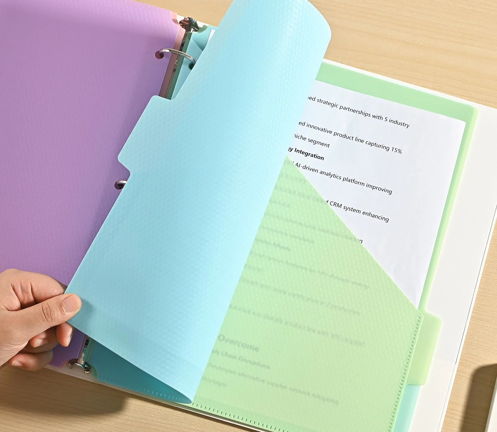 SUIN dividers with colored tabs in an open binder